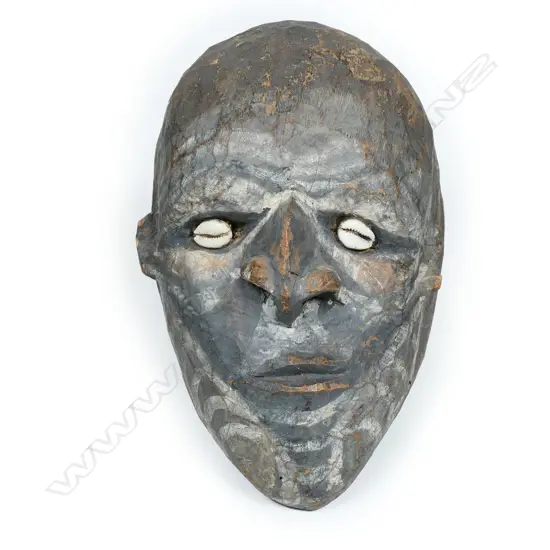 A New Guinean carved wooden head,